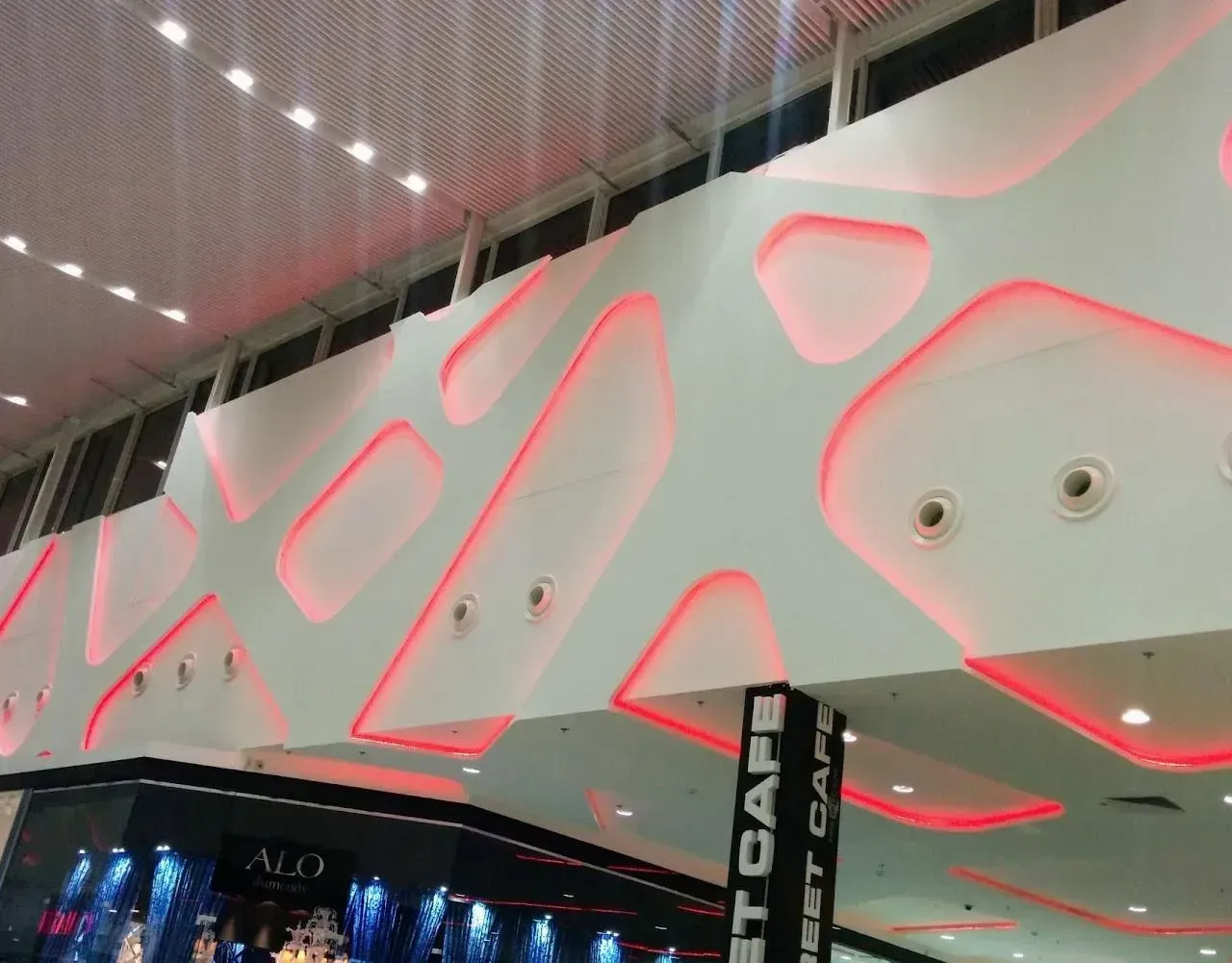 Red colour of RGBW DALI lighting on walls in commercial centre